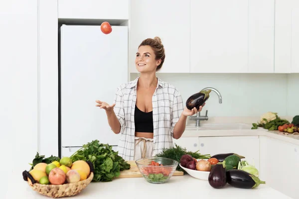 Cheerful Woman Throwing Red Tomato Cooking Vegetarian Meal Home — Stock Photo, Image