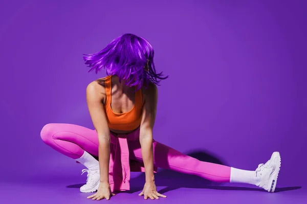 Young Woman Wearing Colorful Sportswear Stretching Workout Purple Background — Stock Photo, Image