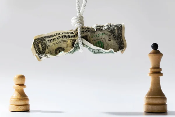 Crumpled One Dollar Bill Hanging White Rope Wooden Chessmen Standing — Stock Photo, Image