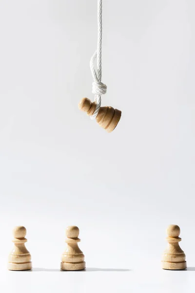 Wooden Chess Pawn Hanging White Rope Other Pawns Standing Concept — Stock Photo, Image