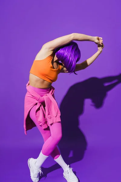 Carefree Young Woman Dancer Wearing Colorful Sportswear Performing Purple Background — Stock Photo, Image