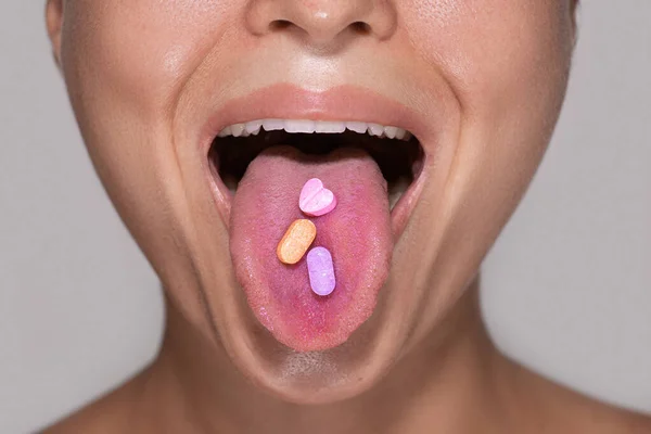 Closeup Shot Bottom Part Young Female Face Colorful Pills Her — Stock Photo, Image