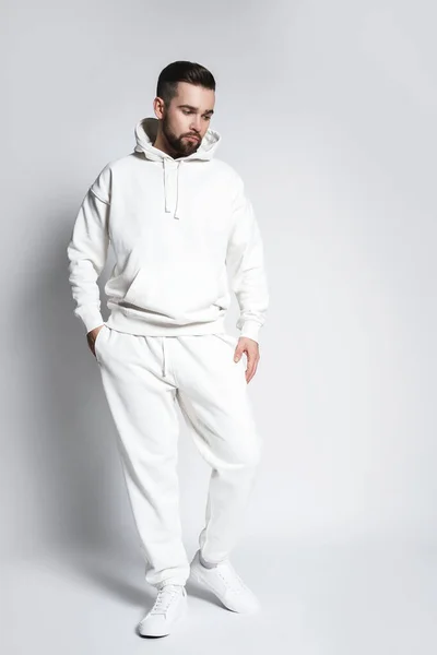 Handsome Man Wearing Blank White Hoodie Pants Posing Gray Background — Stock Photo, Image