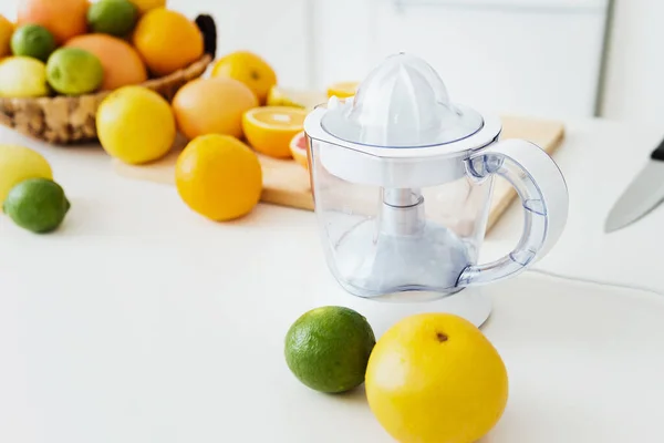 Closeup Empty Juicer Different Citrus Fruits White Kitchen Table — Stock Photo, Image