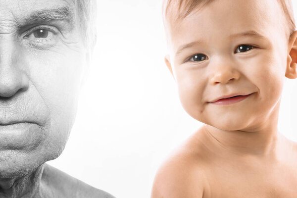 Portrait of elderly man and baby boy. Concept of rebirth and cycle of life.