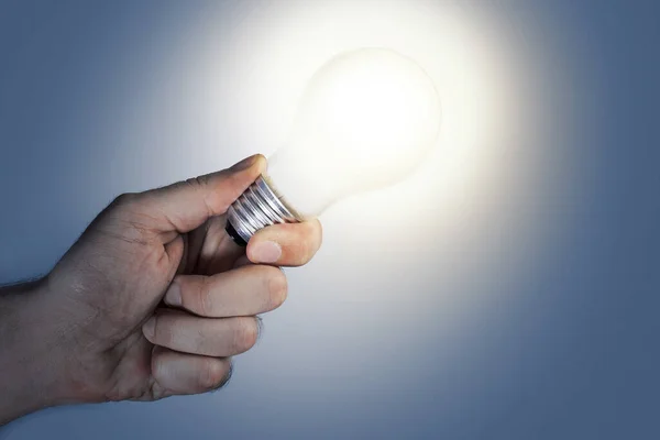 Closeup Male Hand Holding Glowing Light Bulb Concept Ideas Creativity — Stock Photo, Image