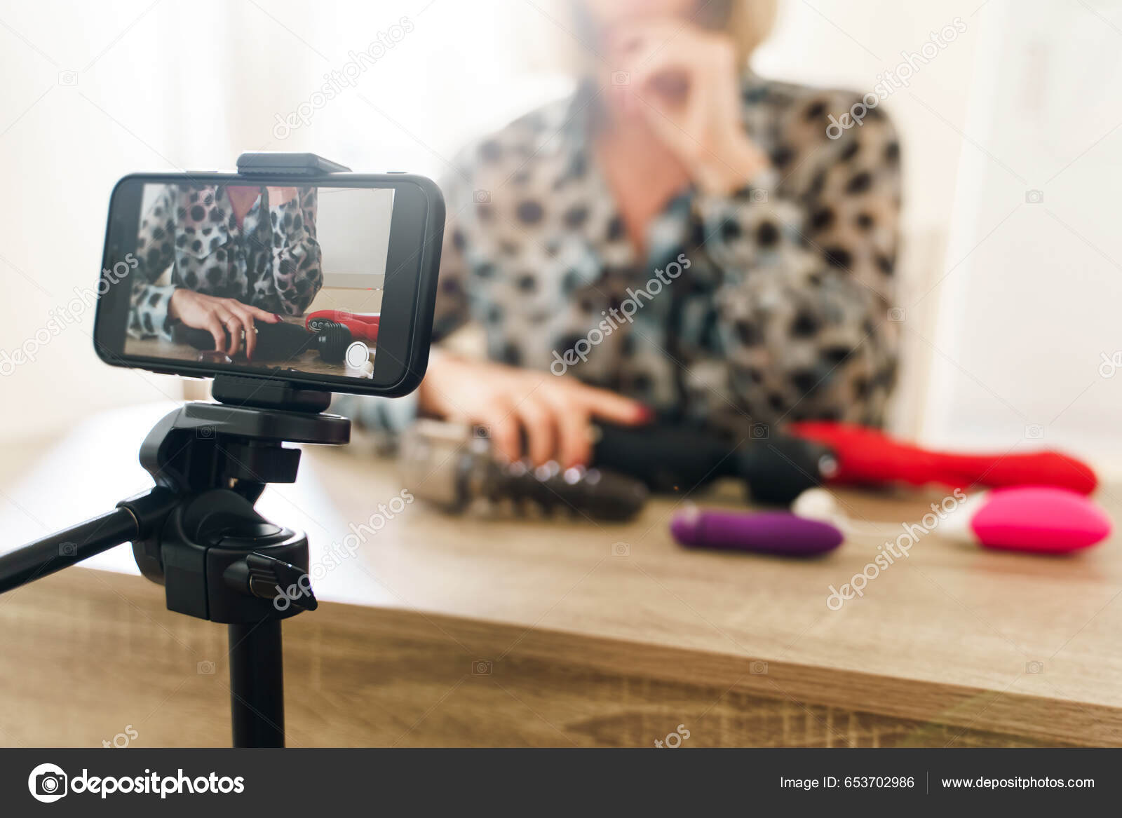 Young Woman Blogger Making Vlog Reviewing Different Sex Toys Stock Photo by ©AY_PHOTO 653702986