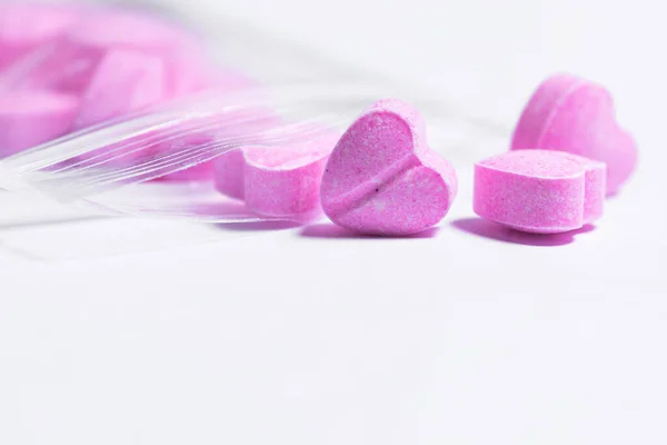 Closeup Shot Transparent Ziplock Bag Pink Heart Shaped Pills White — Stock Photo, Image