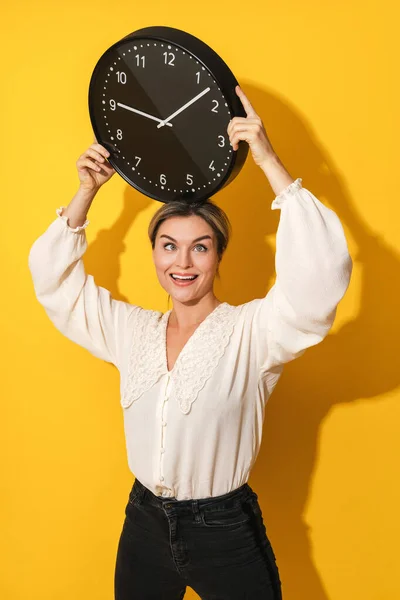 Young Funny Woman Silly Facial Expression Holding Big Clock Yellow — Stock Photo, Image