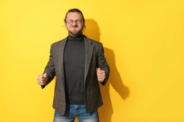 Young Man Making Silly Face Yellow Background — Stock Photo, Image