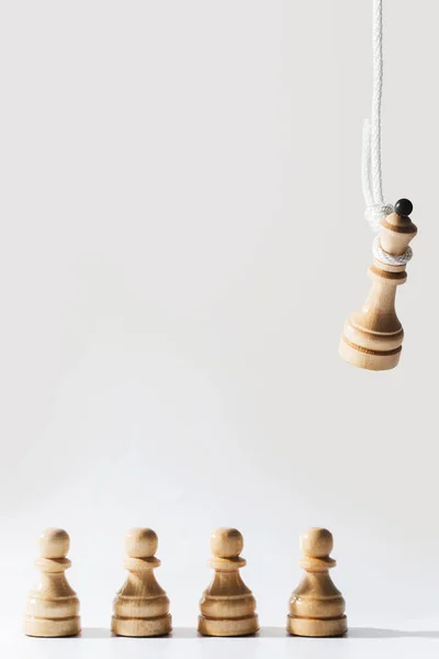Closeup Shot Wooden Chess Queen Hanging White Rope Pawns Standing — Stock Photo, Image