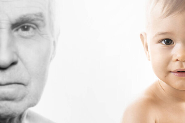 Portrait of elderly man and baby boy. Concept of rebirth and cycle of life.