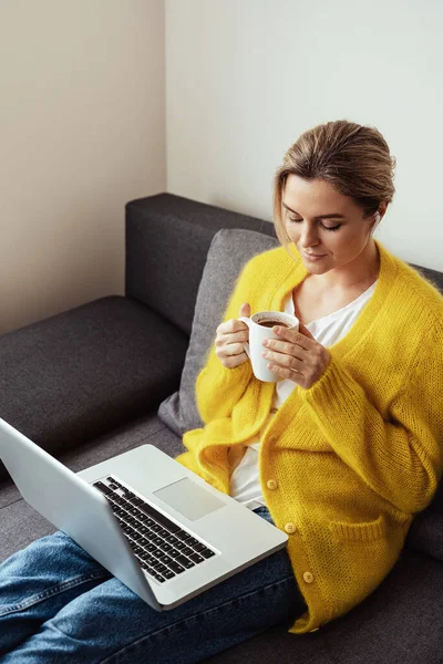 Young Woman Cup Hot Coffee Sitting Sofa Using Laptop Computer — Stock Photo, Image