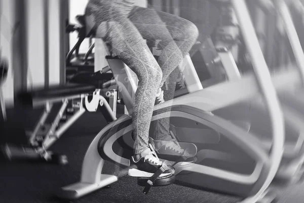 Female Legs Stationary Bicycle Moving Fast Motion Blur Effect — Stock Photo, Image
