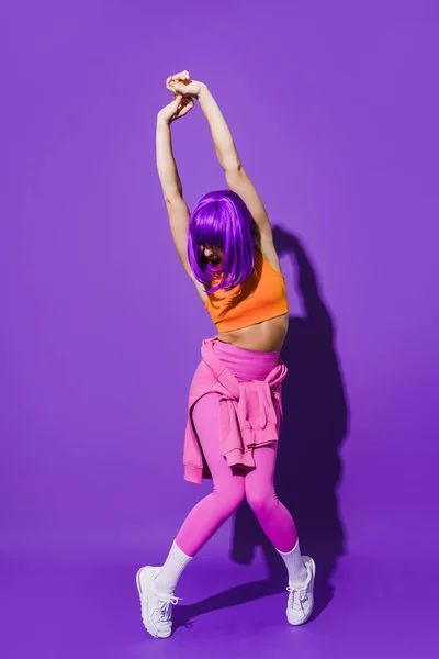 Carefree Young Woman Dancer Wearing Colorful Sportswear Performing Purple Background — Stock Photo, Image