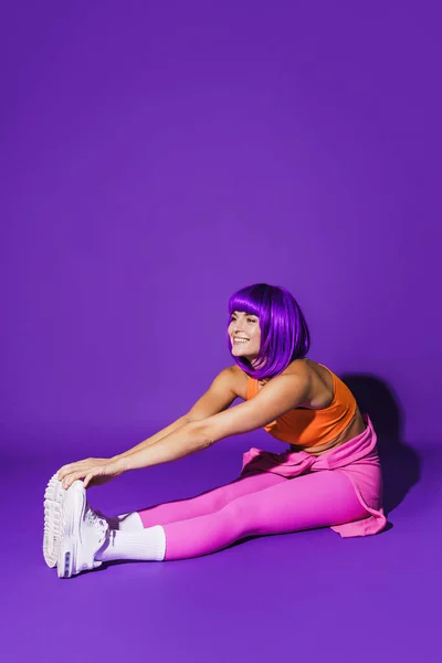 Young Cheerful Woman Wearing Colorful Sportswear Stretching Workout Purple Background — Stock Photo, Image