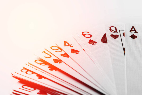 Closeup of french-suited playing cards on the table.