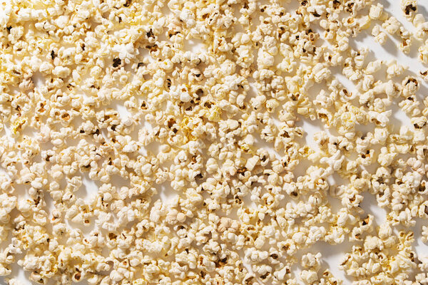 Closeup of scattered popcorn with hard lighting.
