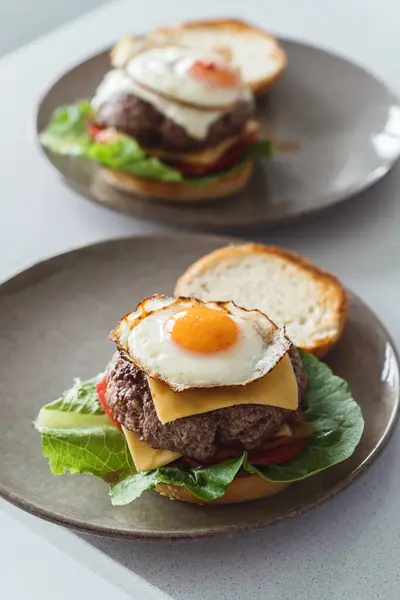 Delectable Homemade Cheeseburger Garnished Perfectly Fried Sunny Side Egg Stock Photo
