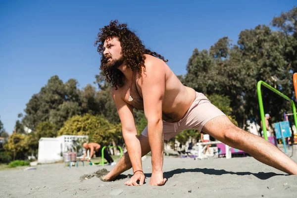 Young Curly Bearded Man His Stretching Workout Beach — Stock Photo, Image