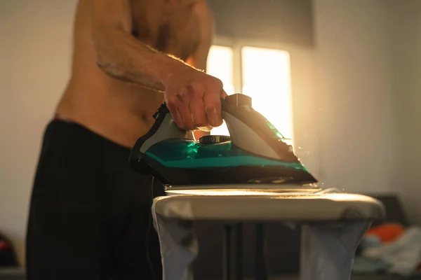 Shirtless Man Using Flatiron Ironing His Clothes Home — Stock Photo, Image
