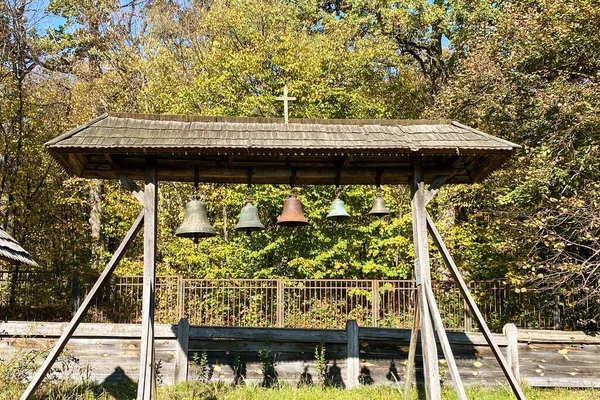 Church bells in tradition village. Orthodox wooden church.