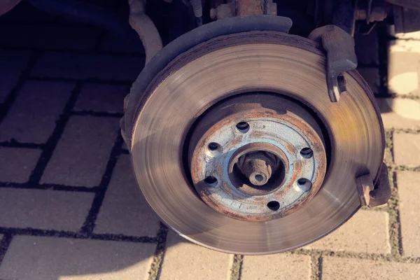 Car repair concept. Repair of a wheel on a passenger car. Wheel balancing or repair.
