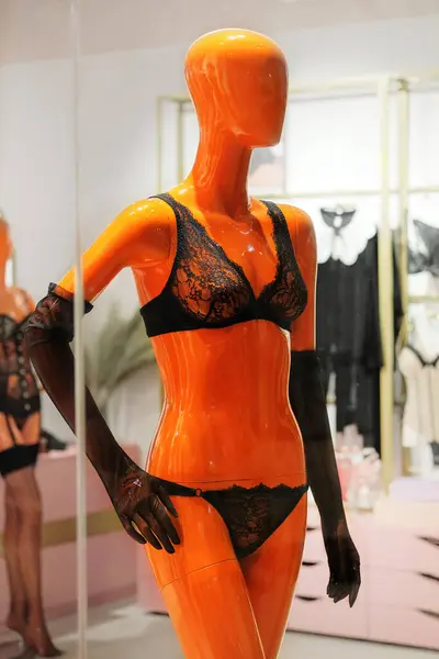 Mannequins in black underwear stand in a clothing store. Female mannequins in the big mall.