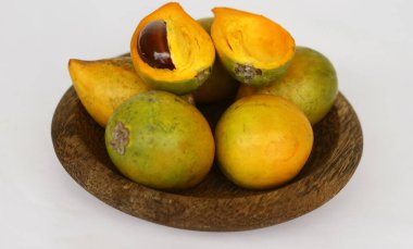 Eggfruit or canistel on white background. 