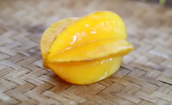 stock image Starfruit on a bamboo mat.