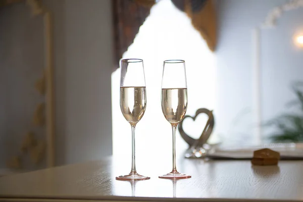 wedding glasses with champagne wine in the registry office at the ceremon