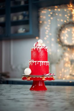 Delightful red cake with white decorations, winter celebrations and holiday gatherings clipart