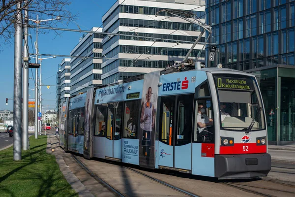 stock image VIENNA, AUSTRIA - Aprile 14, 2022. Tram Siemens ULF-A1 #52 riding with passengers in the streets of Vienna.