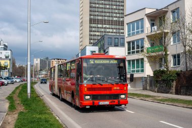 BRATISLAVA, SLOVAKIA - April 02, 2022. Bus Karosa B741 #2646 riding with passengers in the streets of Bratislava.