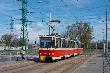 BRATISLAVA, SLOVAKIA - April 06, 2022. Trams Tatra T6A5 #7909 and 7910 riding with passengers in the streets of Bratislava.