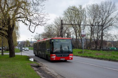 BRATISLAVA, SLOVAKIA - April 10, 2022. Bus SOR NB 18 City #1865 riding with passengers in the streets of Bratislava.