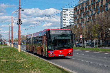 BRATISLAVA, SLOVAKIA - April 11, 2022. Bus Solaris Urbino 18 #3229 riding with passengers in the streets of Bratislava.