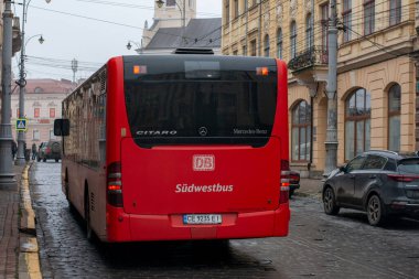 CHERNIVTSI, UKRAINE - January 11, 2023. Bus Mercedes-Benz O530 riding with passengers in the streets of Chernivtsi.
