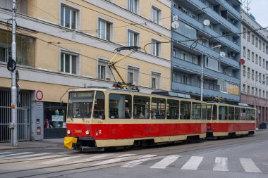 BRATISLAVA, SLOVAKIA - April 23, 2022. Trams Tatra T6A5 #7909 and 7910 riding with passengers in the streets of Bratislava.