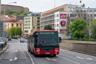 BRATISLAVA, SLOVAKIA - April 24, 2022. Bus SOR NB 18 City #4266 riding with passengers in the streets of Bratislava.