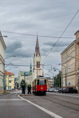 BRATISLAVA, SLOVAKIA - April 24, 2022. Trams DPMB #38 and CGP-DPMB #135 riding with passengers in the streets of Bratislava.