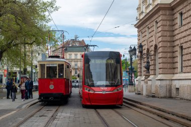 BRATISLAVA, SLOVAKIA - April 24, 2022. Trams DPMB #38, CGP-DPMB #135 and Skoda 29T1 #7413 riding with passengers in the streets of Bratislava.