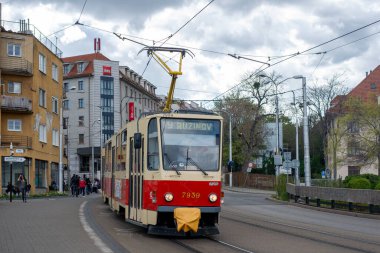 BRATISLAVA, SLOVAKIA - April 24, 2022. Trams Tatra T6A5 #7939 and 7940 riding with passengers in the streets of Bratislava.