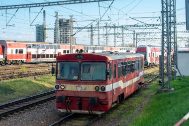 BRATISLAVA, SLOVAKIA - April 25, 2022. Train ZOS Zvolen Class 812 #812 026-7 riding with passengers in the streets of Bratislava.