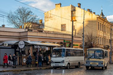 CHERNIVTSI, UKRAINE - January 18, 2023. Buses I-VAN A07 (Tata) and PAZ-32054 riding with passengers in the streets of Chernivtsi.