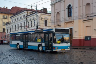 CHERNIVTSI, UKRAINE - January 18, 2023. Bus MAN A10 riding with passengers in the streets of Chernivtsi.