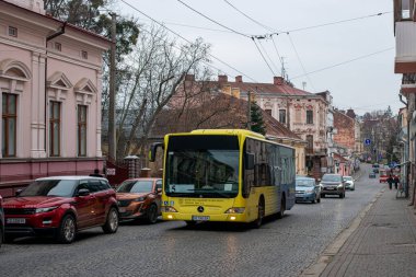 CHERNIVTSI, UKRAINE - January 26, 2023. Bus Mercedes-Benz O530 riding with passengers in the streets of Chernivtsi.