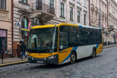 CHERNIVTSI, UKRAINE - January 26, 2023. Bus Castrosua Magnus (MAN) riding with passengers in the streets of Chernivtsi.