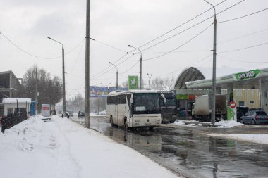 CHERNIVTSI, UKRAINE - February 06, 2023. Bus Mercedes-Benz O350-15RHD riding with passengers in the streets of Chernivtsi.
