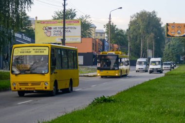 CHERNIVTSI, UKRAINE - Jule 30, 2020. Buses Bogdan A069, Mercedes-Benz Sprinter 310D and trolleybus Dnipro T203 (MAZ) #385 riding with passengers in the streets of Chernivtsi.